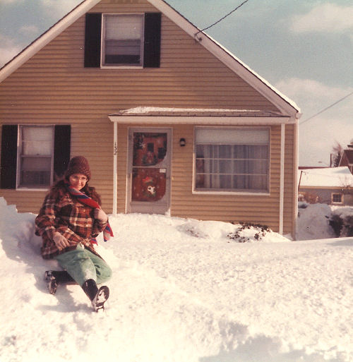 Linda on top of snowplow pile