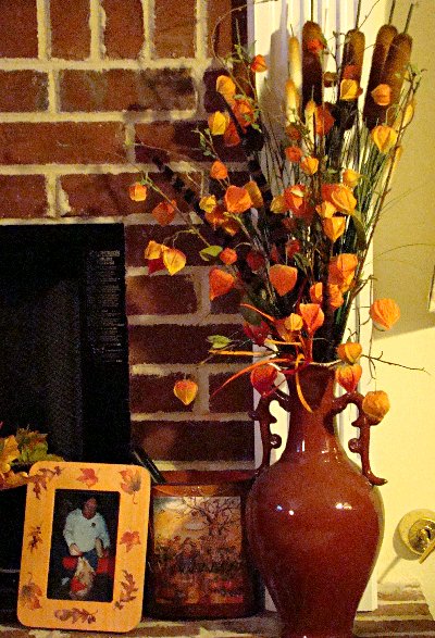 vase of Chinese lanterns and cattails