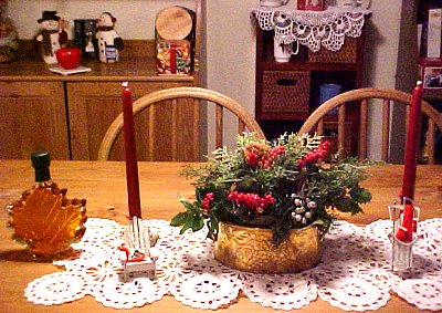 table and china cabinet with winter decorations