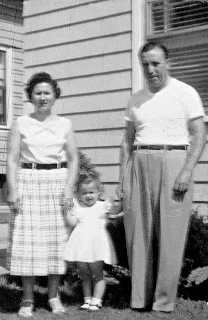 Mom and Dad with little me in the middle